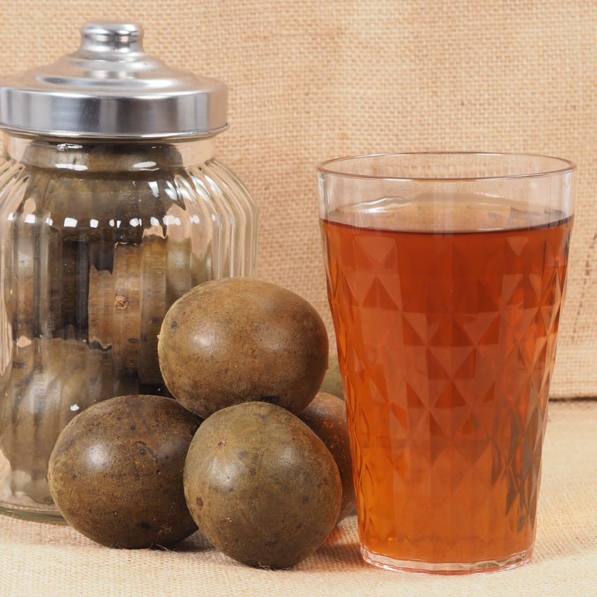 A Jar of Monk Fruit and a Glass of Monk Fruit Syrup