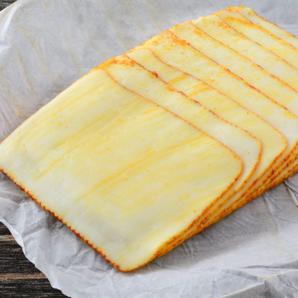 Stacks of Muenster Cheese on a Parchment Paper