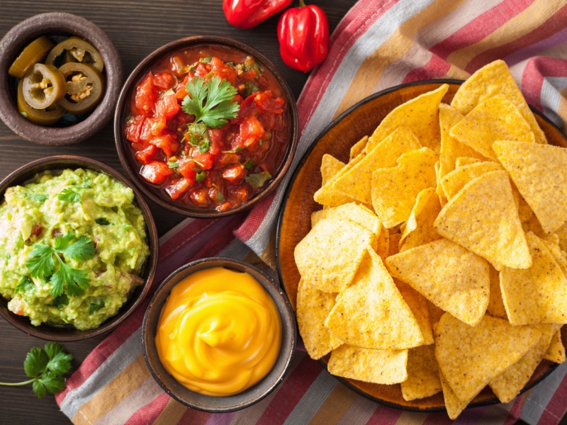 Nachos With Guacamole, Salsa and Cheese Dips