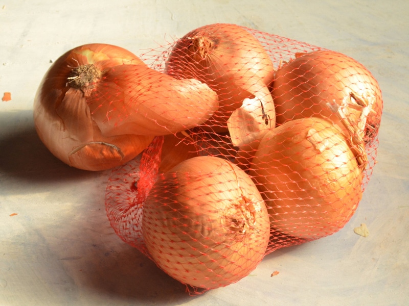 Yellow Onions in a Mesh Bag
