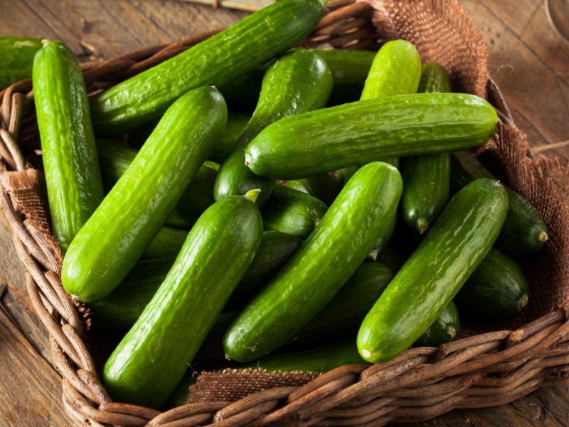 Bunch of Persian Cucumbers in a Woven Basket
