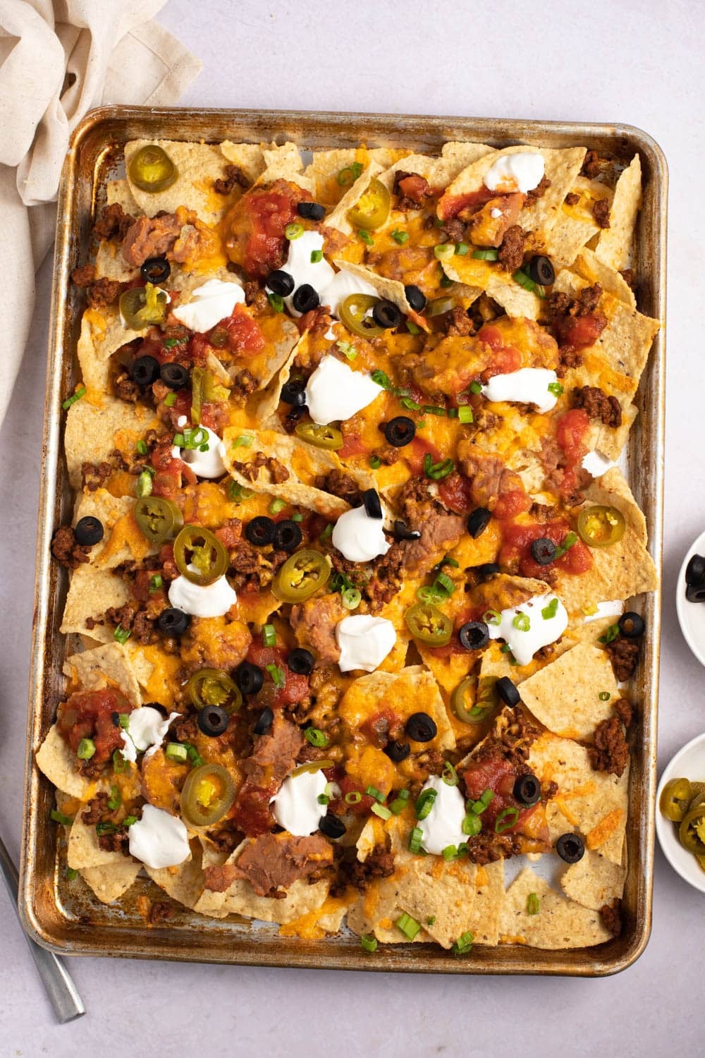Quick and Easy Super Nachos with Black Olives, Ground Beef and Sour Cream
