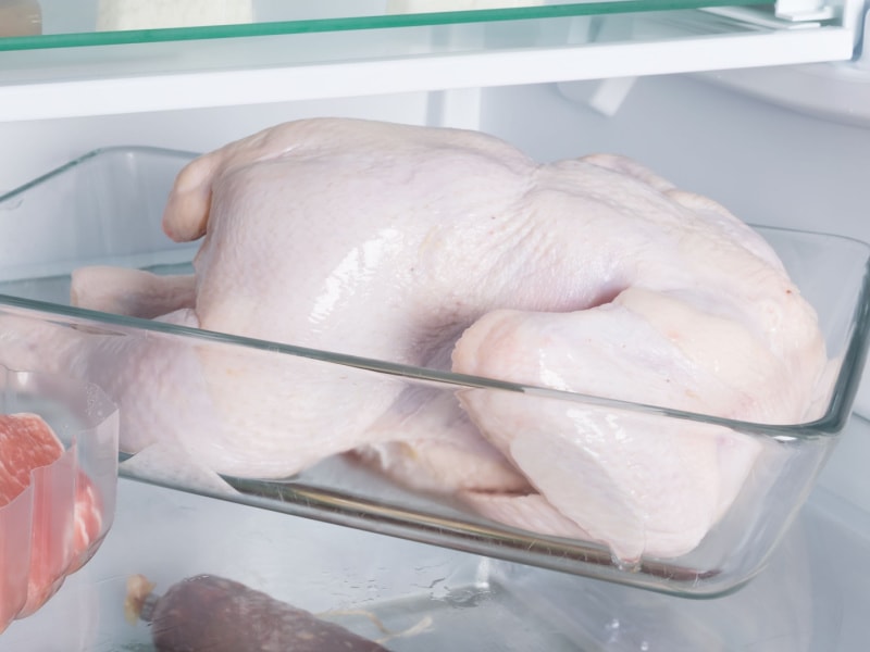 Raw Whole Chicken in Refrigerator