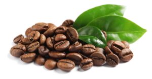 Roasted Coffee Beans with Fresh Green Leaves