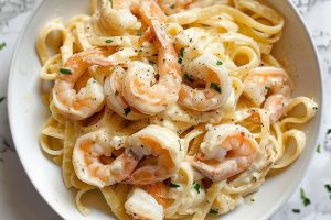 Top View of Shrimp Alfredo on a White Plate