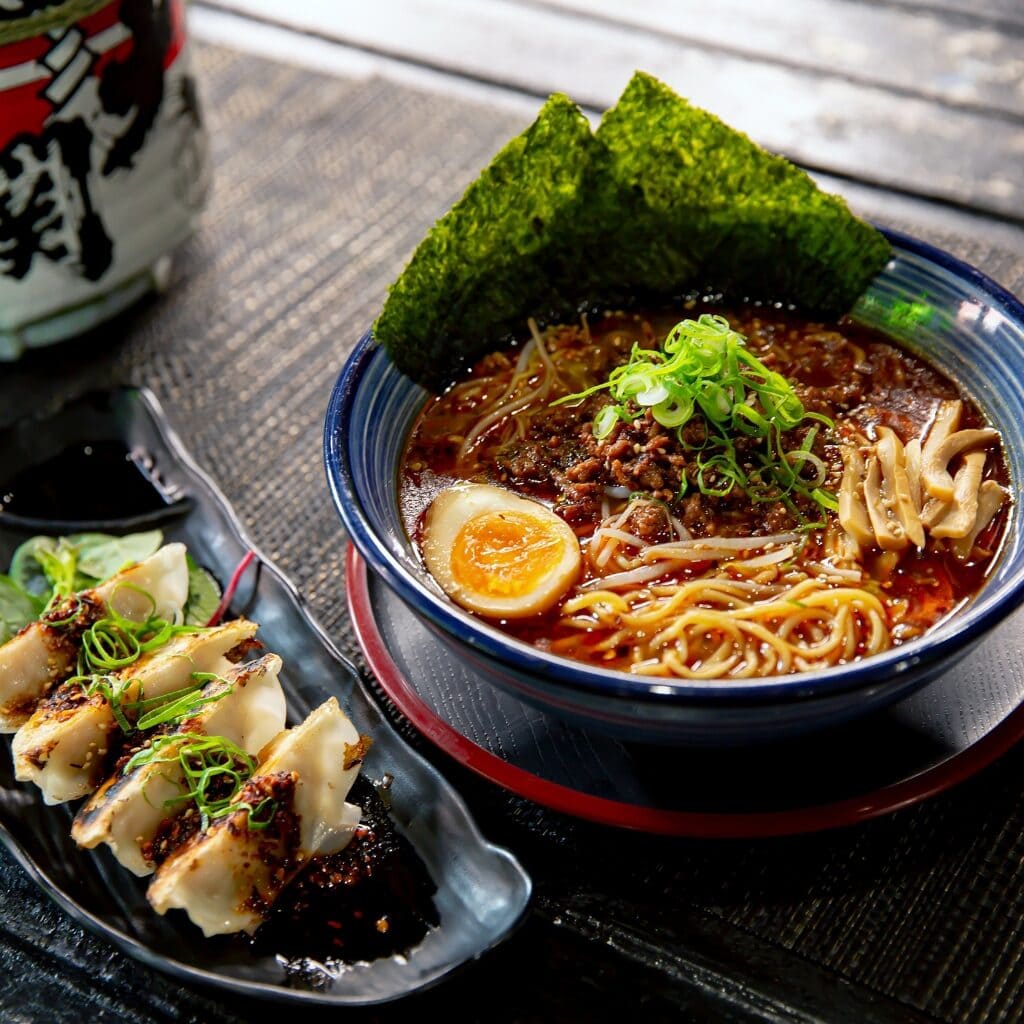 Spicy Ramen with Dandan Noodles, Egg, Nori and Gyoza