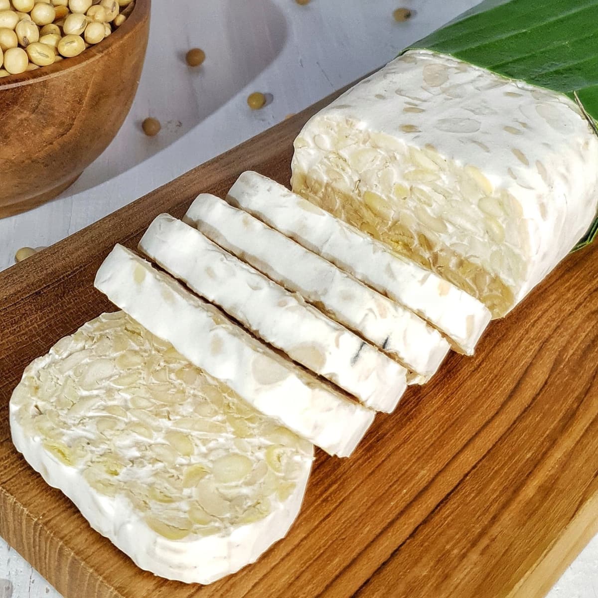 Slices of Tempeh on a Wooden Board