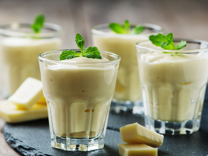 White Chocolate Mouse in Small Glasses with Mint Leaves