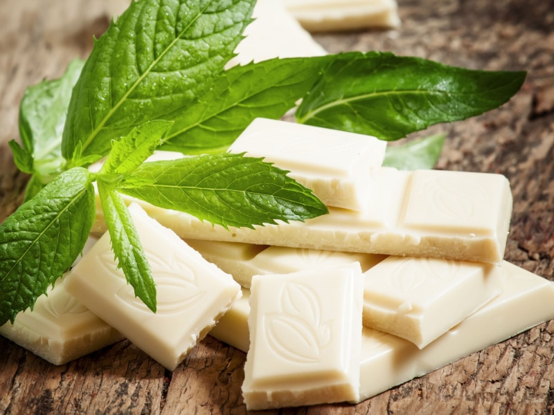 White Chocolate with Mint on a Wooden Table