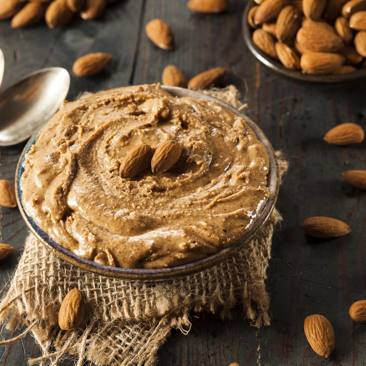 Almond Nuts and Creamy Almond Butter in a Glass Dish