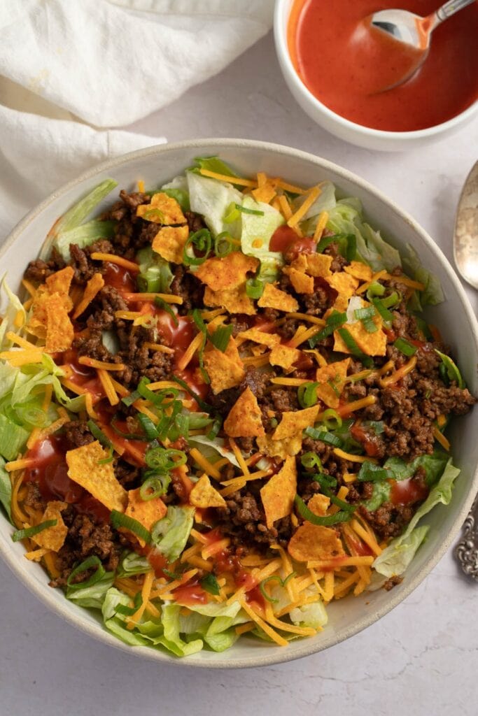 Bowl of Homemade Ground Beef Taco Salad with Lettuce, Cheese and Sauce