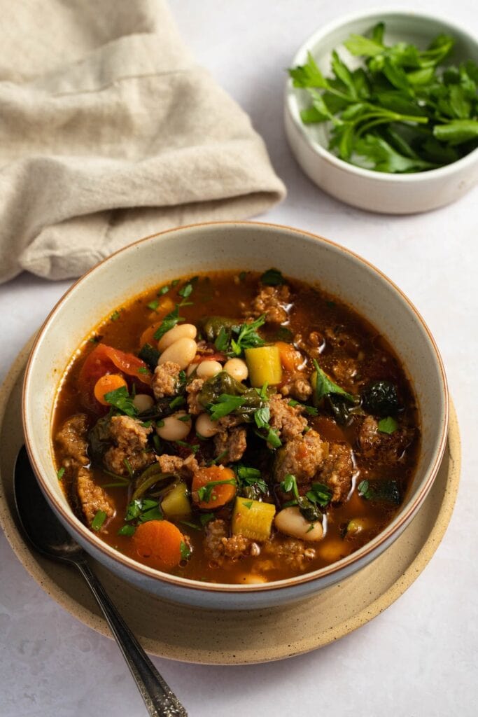 Bowl of Italian Sausage Soup with Beans and Veggies