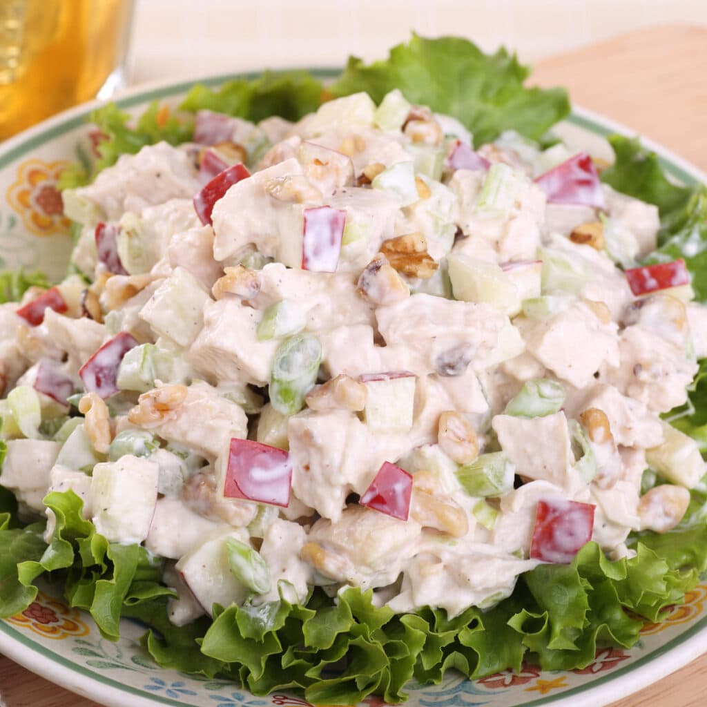 Homemade Creamy Chicken Salad Served on Top of Fresh Lettuce 