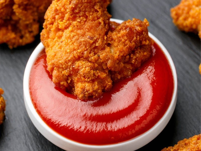 Fried chicken smothered in ketchup
