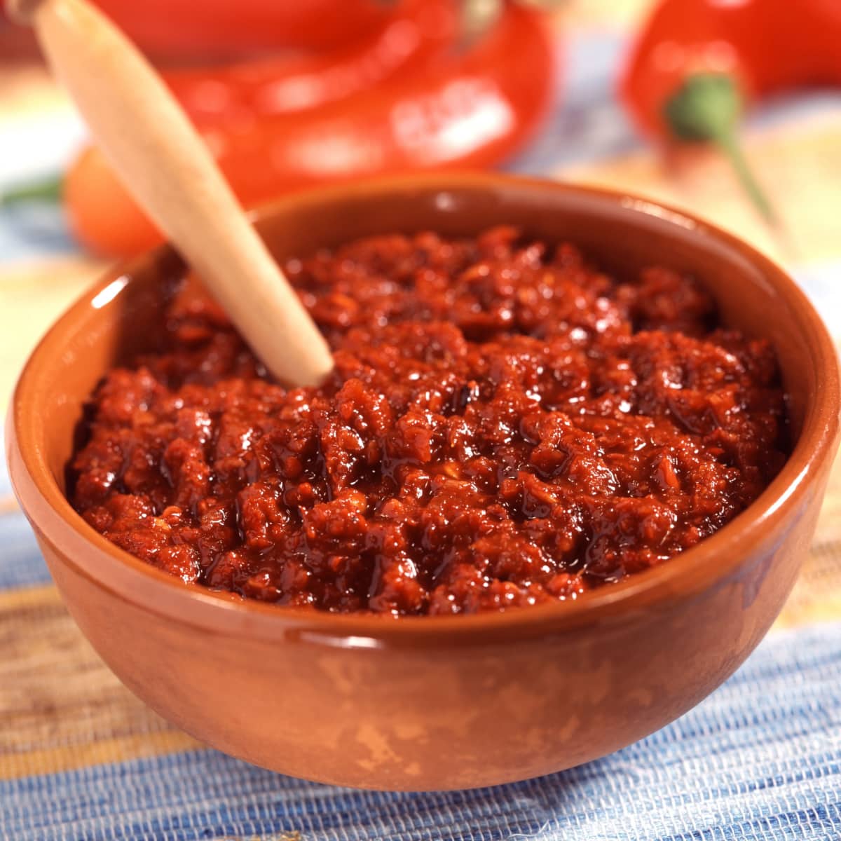Harissa on a Ceramic Bowl with Wooden Spoon