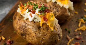 Homemade Baked Potato with Cheese, Bacon and Green Onions