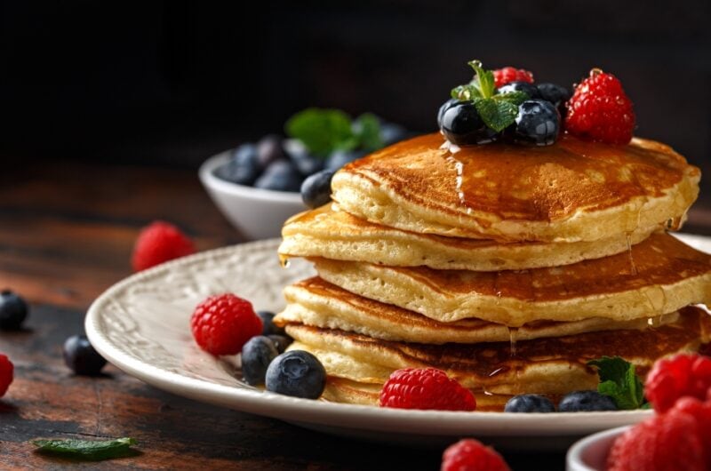 Homemade Fluffy Pancakes with Syrup and Berries