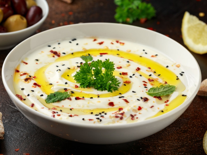 Large Bowl of Labneh Cheese Dip with Olive Oil and Seasonings