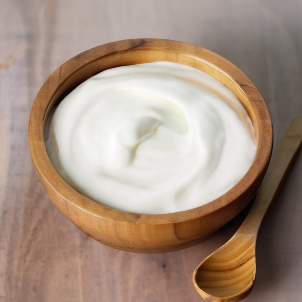 Mayonnaise in a Wooden Bowl with a Wooden Spoon