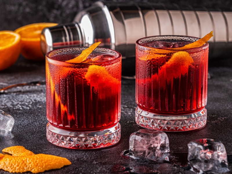 Two Glasses of Negroni Cocktails with Orange Peel