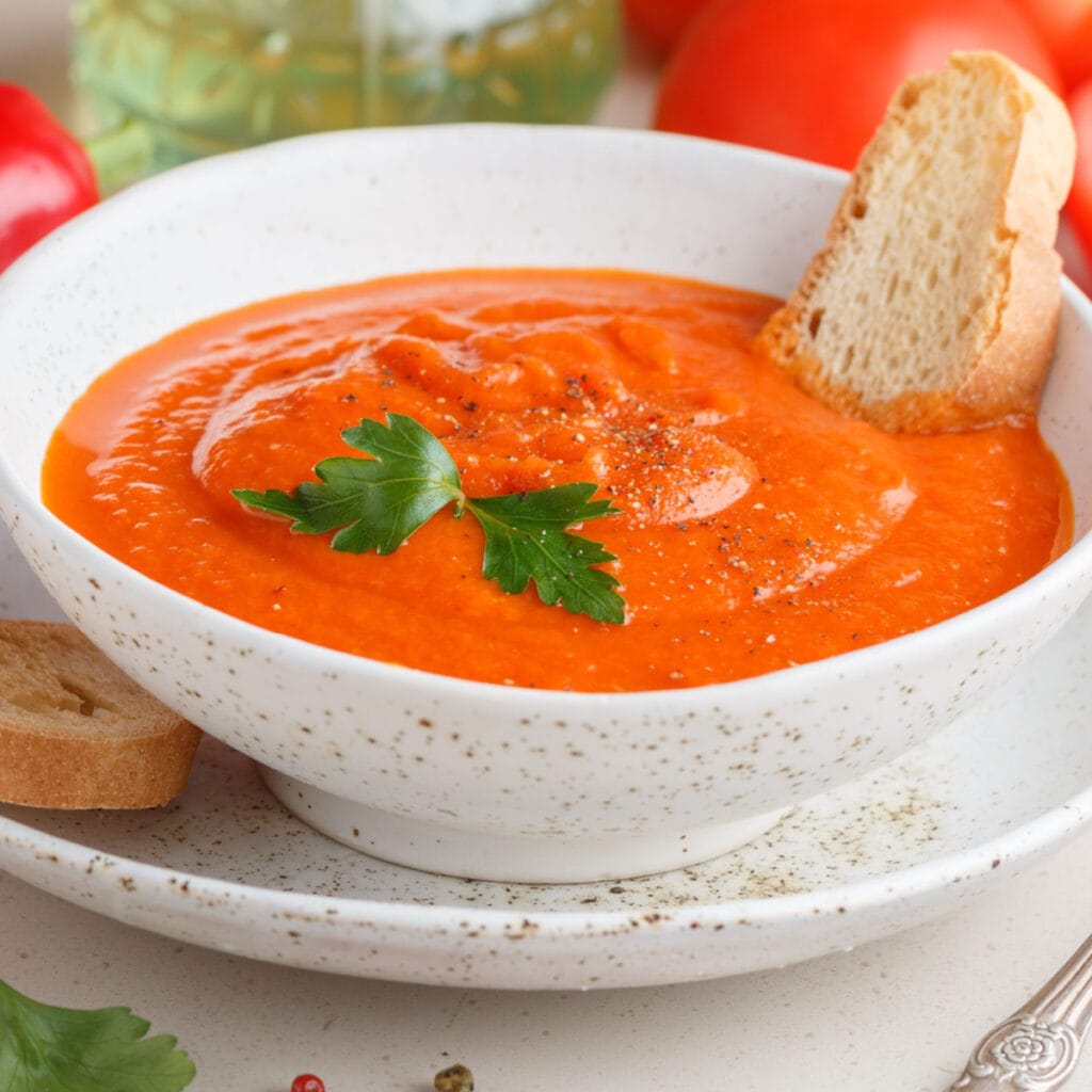 Coarse puree of red peppers in a bowl with parsley and spices 