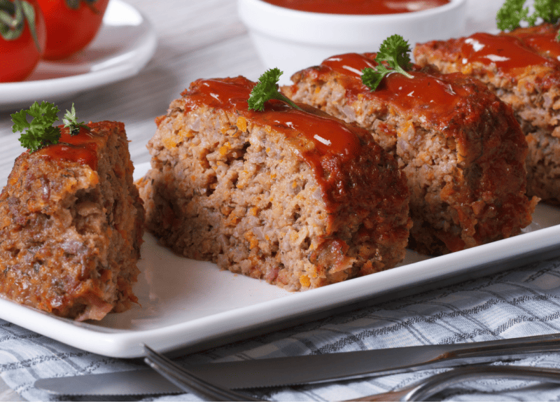 Sliced Meatloaf on a Long White Plate