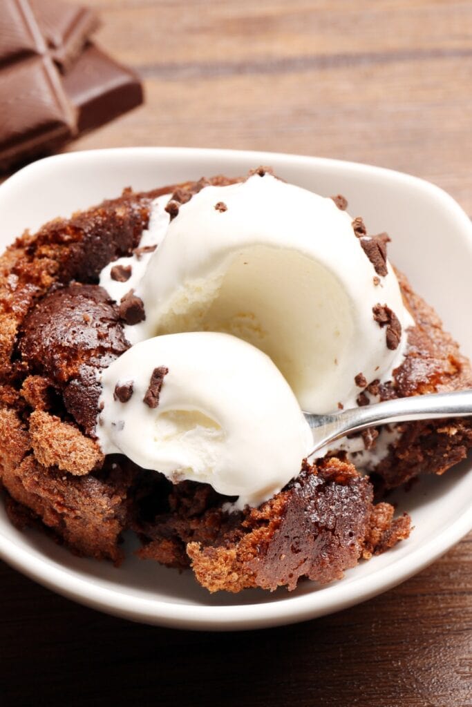 Sweet Lava Cake with Ice Cream Scoop in a White Bowl