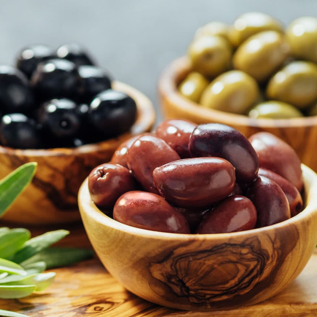 Variety of Olives on a Wooden Bowl