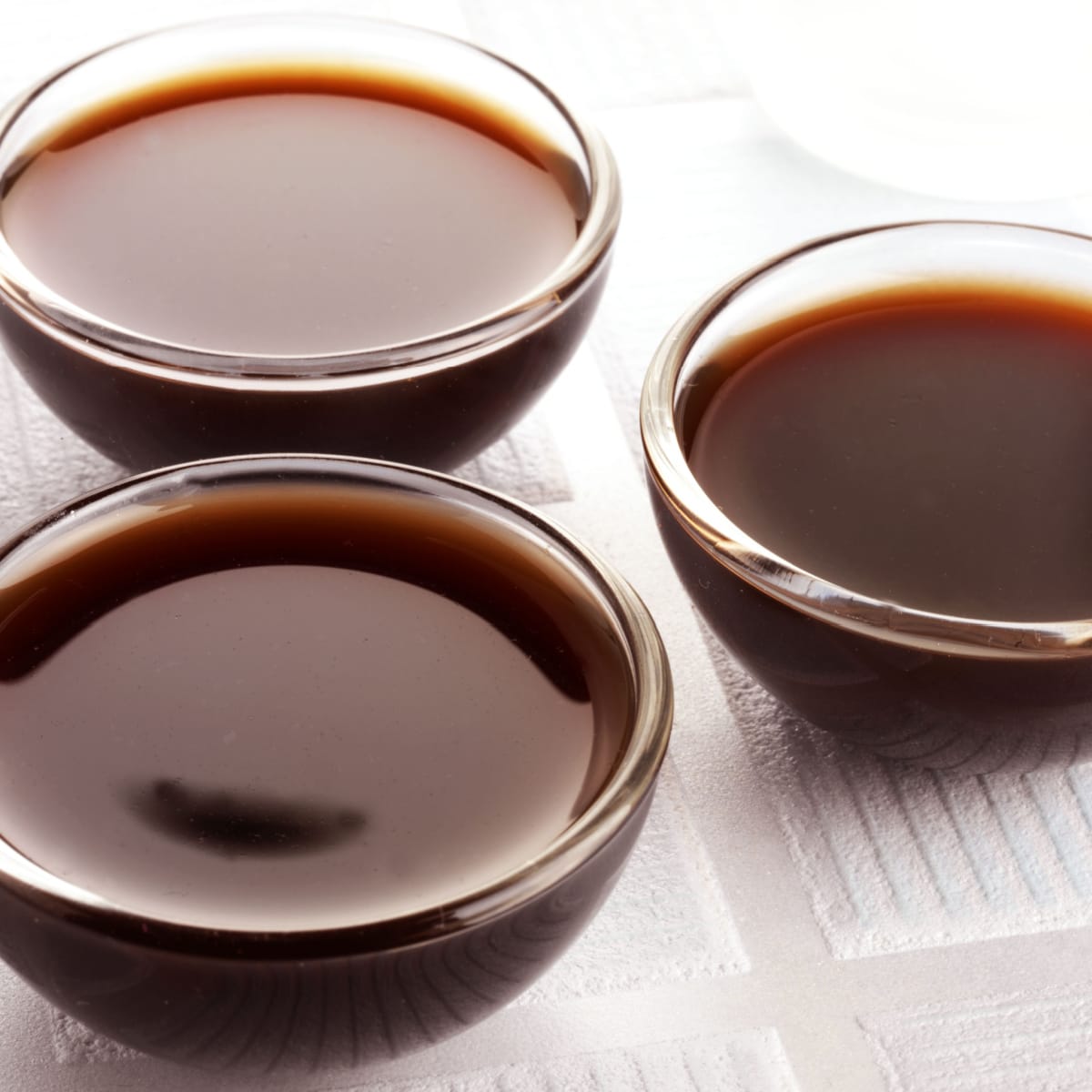 Three Bowls of Worcestershire Sauce on a Table