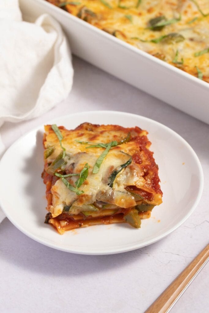 A Slice of Vegetable Lasagna with Zucchini and Mushrooms in a Plate