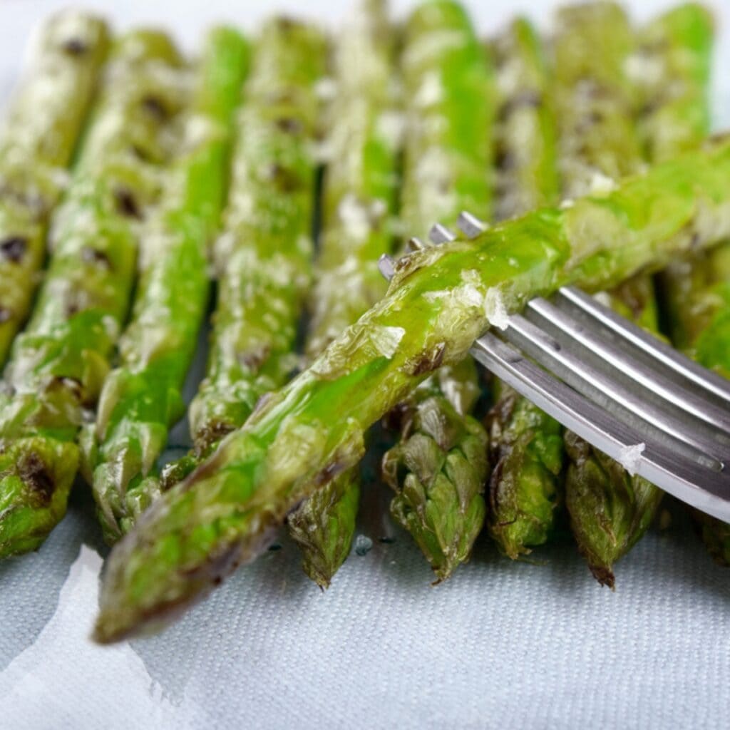 Baked and Seasoned Asparagus Pierced With a Fork