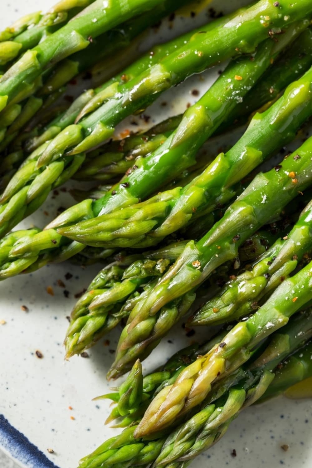 How Long to Bake Asparagus at 350 (Easy Recipe) featuring Seasoned and Roasted Asparagus on a Platter