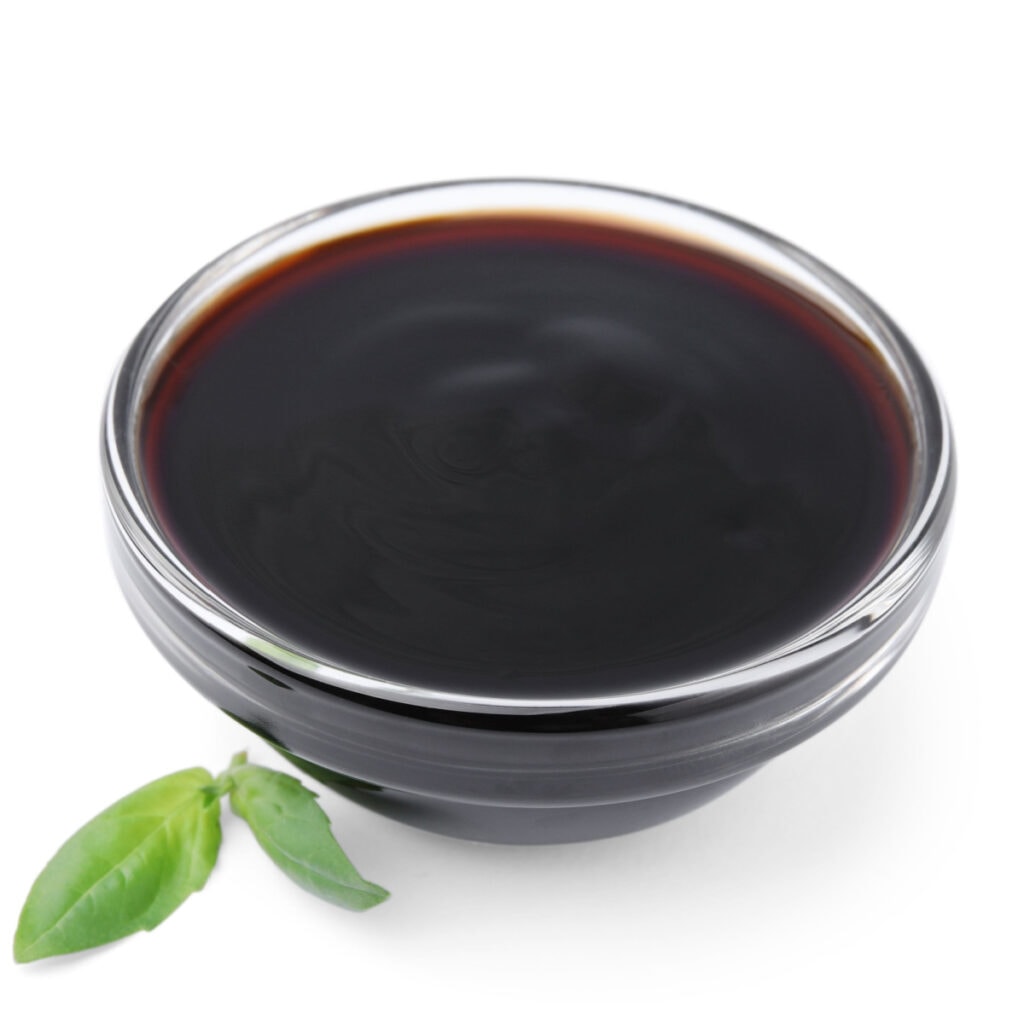 A Bowl of Balsamic Glaze on White Background