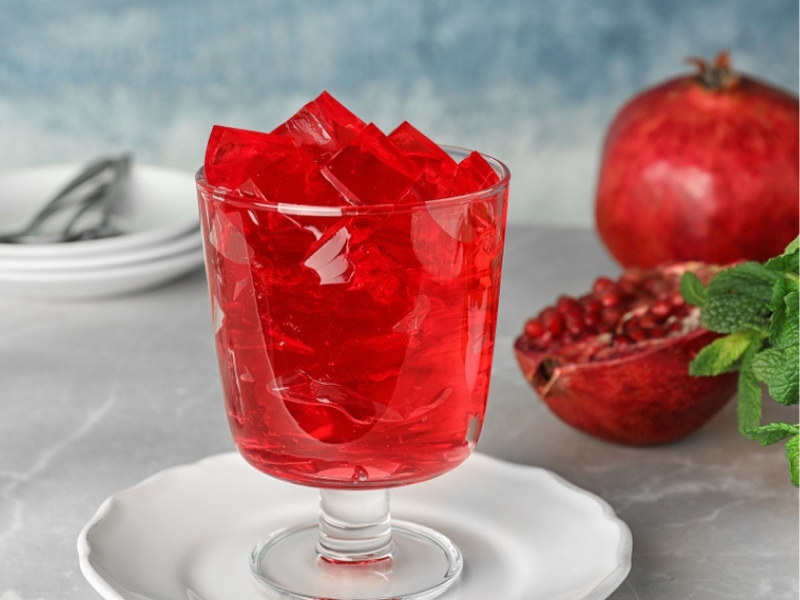 Blue Pomegranate Jell-O Cubes on a Glass
