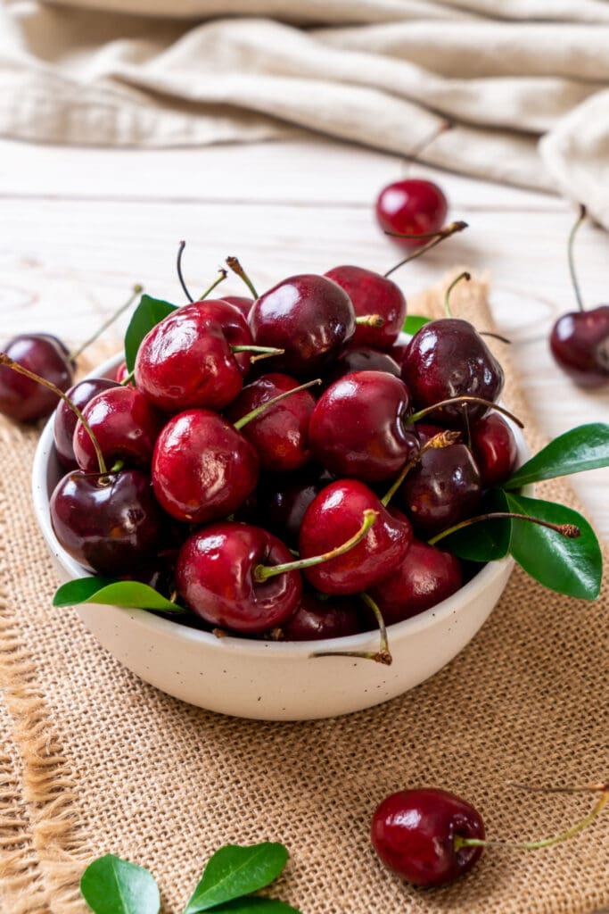 Fresh Ripe Cherries with Leaves on a Bowl