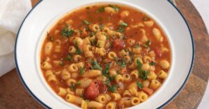 Bowl of Warm Pasta Fagioli with Diced Tomatoes and Parsley