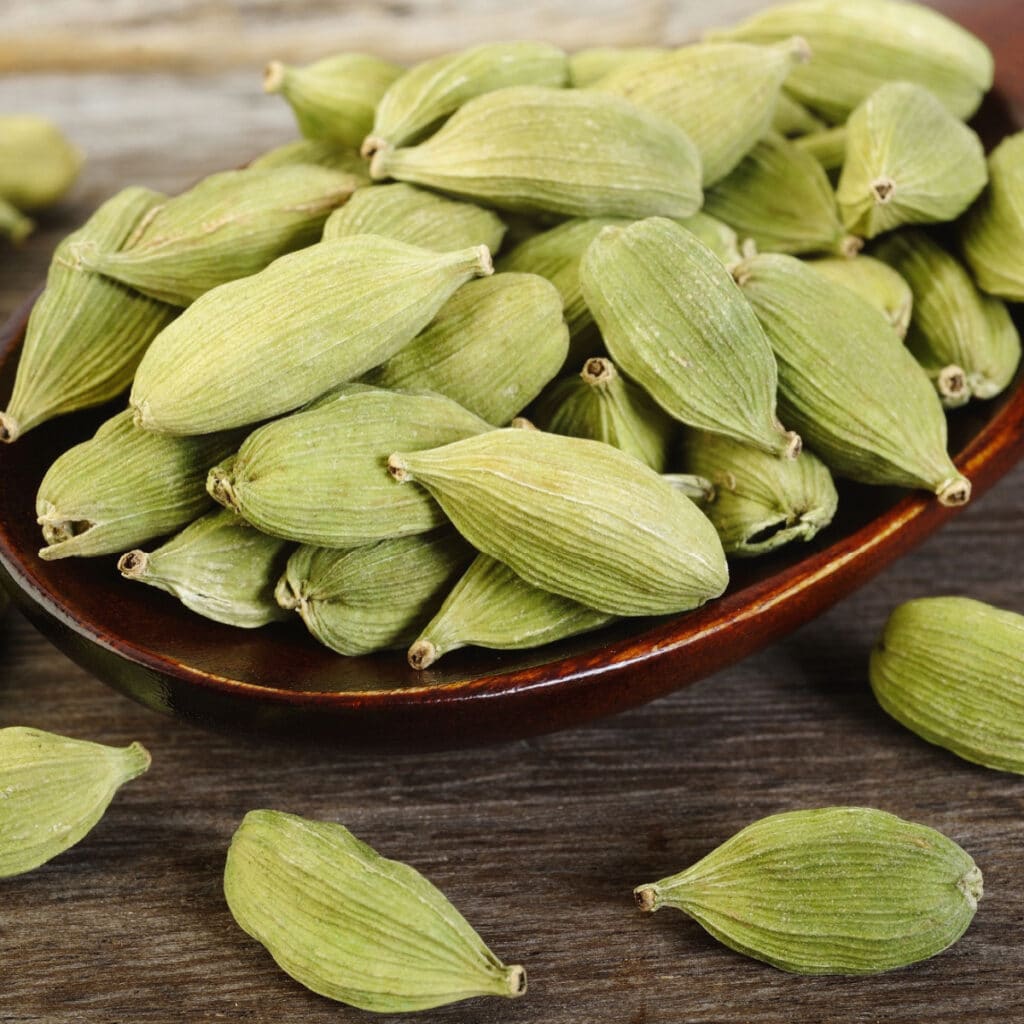 Heap of Cardamom on a Wooden Spoon