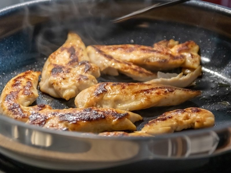 Chicken Cuts Reheated on a Pan