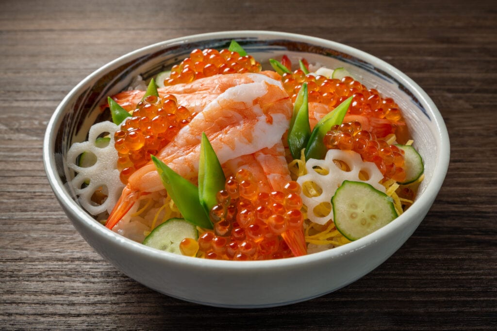 A Bowl of Japanese Chirashi Sushi with Assorted Toppings