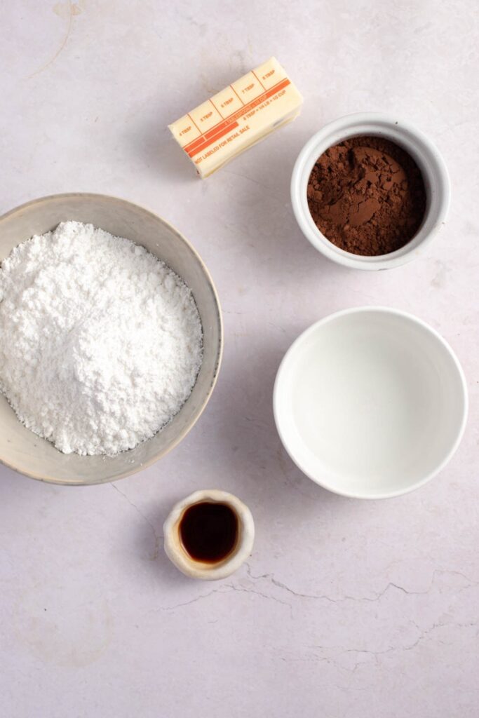 Chocolate Glaze Ingredients - Cocoa Powder, Butter, Powdered Sugar, Vanilla Extract and Hot Water