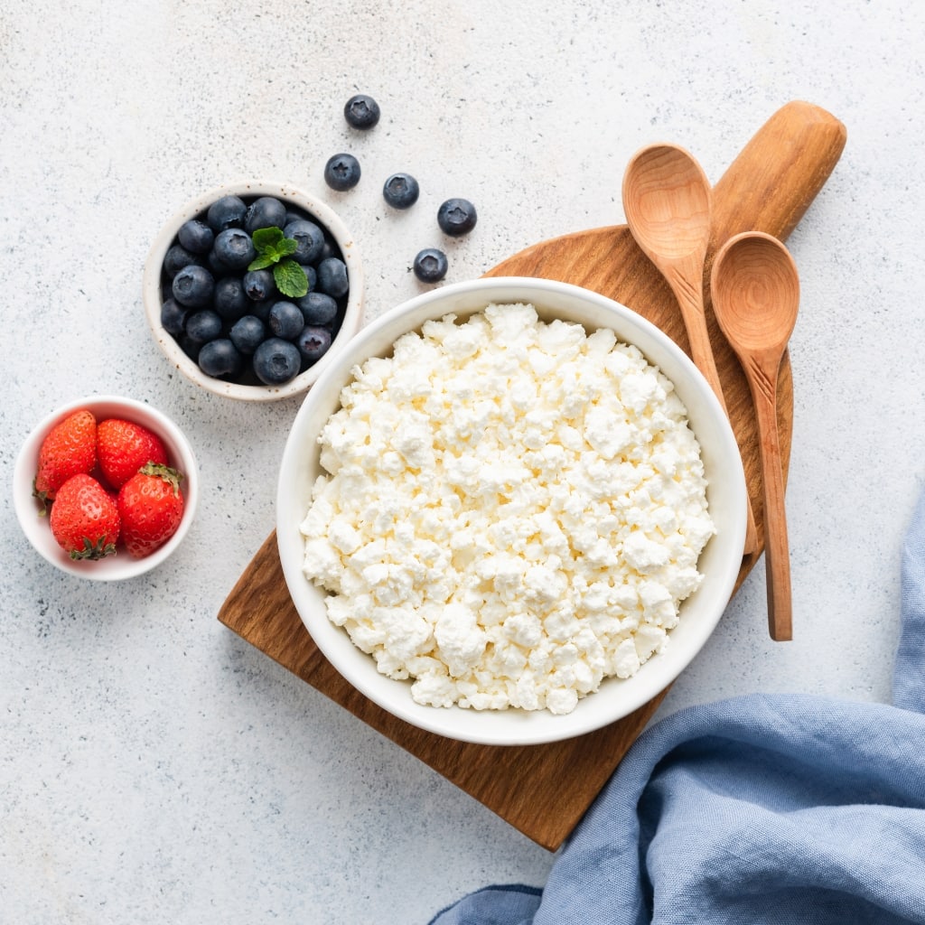 Cottage cheese in a bowl with fresh berries.