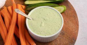 Creamy Homemade Green Goddess Dressing with Carrots and Cucumber