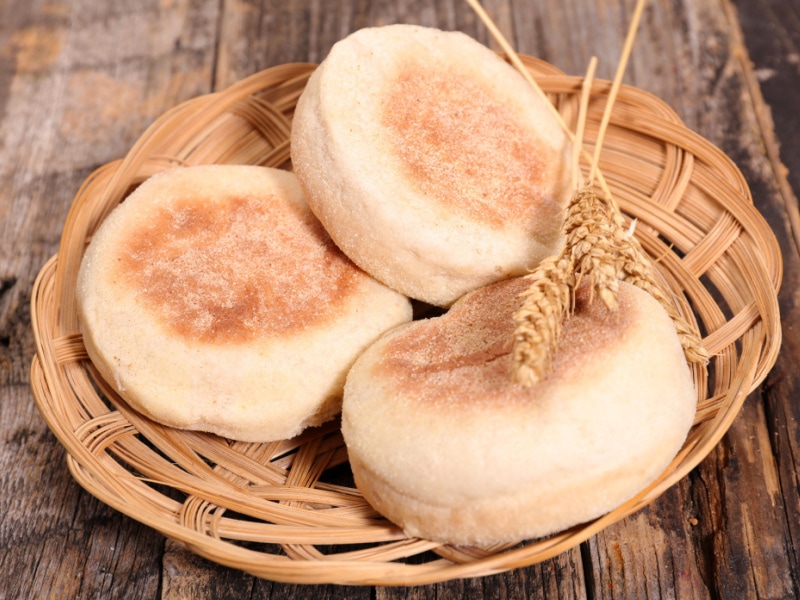 Three English Muffins on a Woven Plate