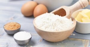 Flour in a Bowl and Other Ingredients for Baking