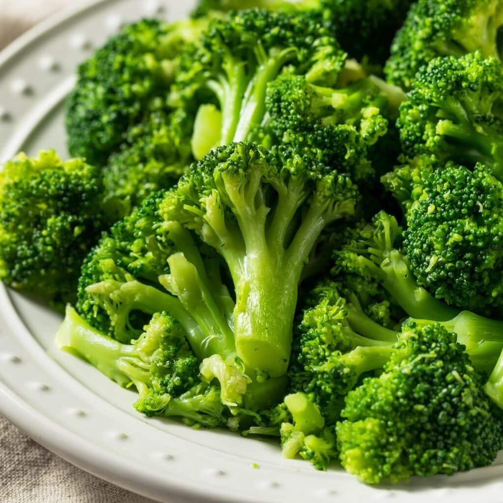 Freshly Steamed Broccoli on a White Plate