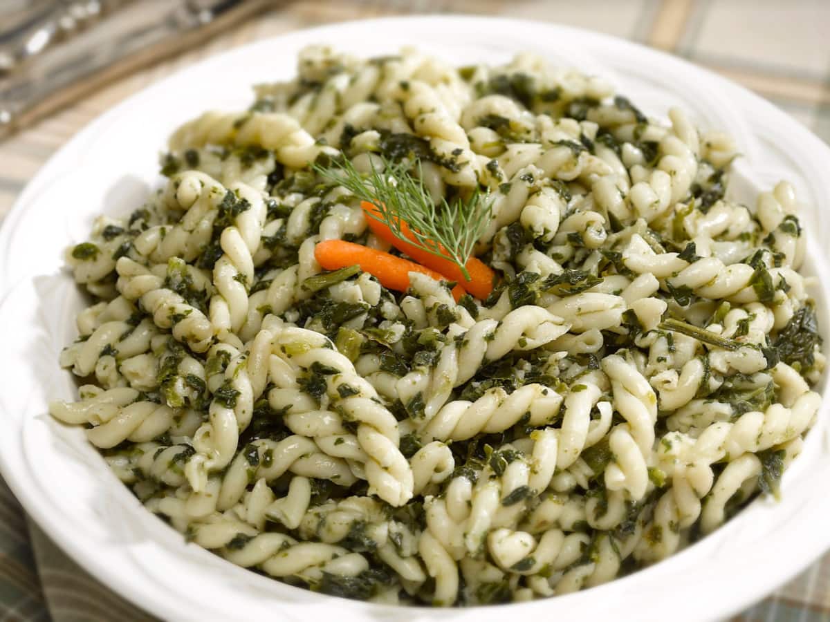 Spinach Gemelli Pasta Salad in a White Bowl