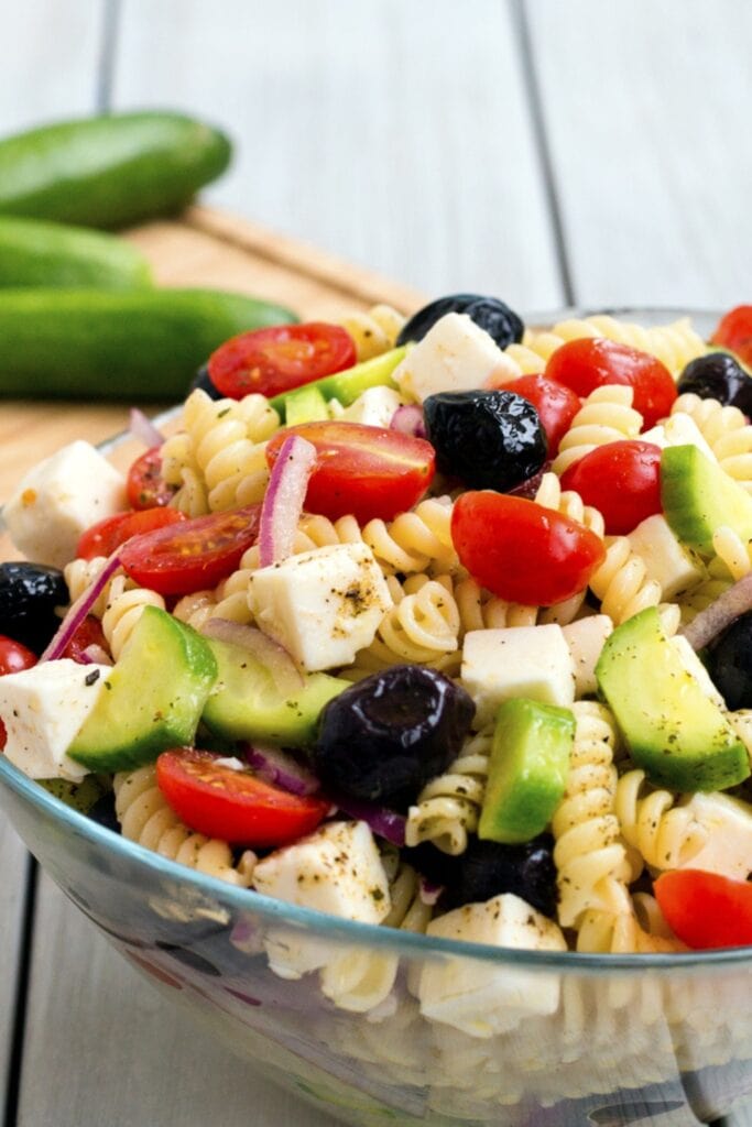 Easy, Healthy Greek Pasta Salad (Best Recipe) featuring Fresh Greek Pasta Salad in a Glass Bowl