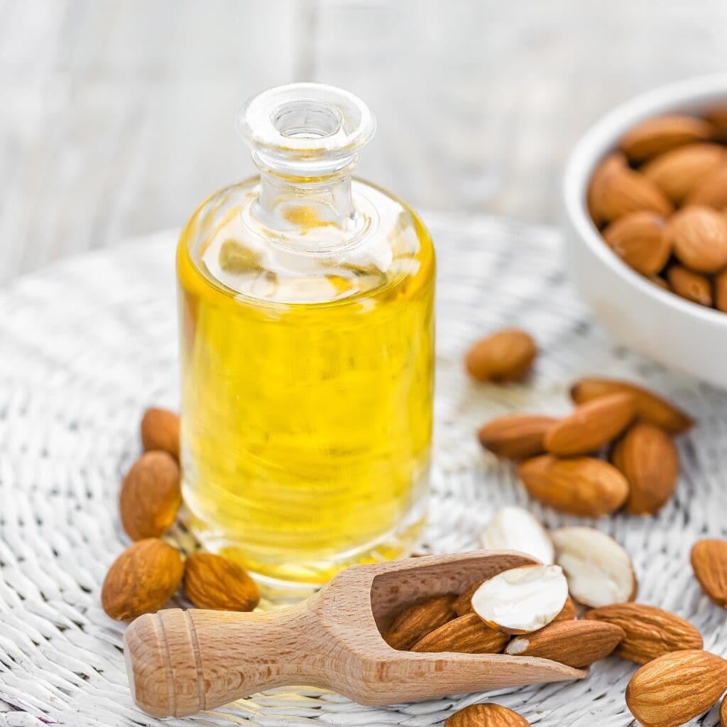 Homemade Almond Extract in a Bottle with Nuts