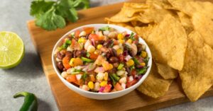 Homemade Cowboy Caviar Dip with Beans, Corn, Tomatoes and Chips