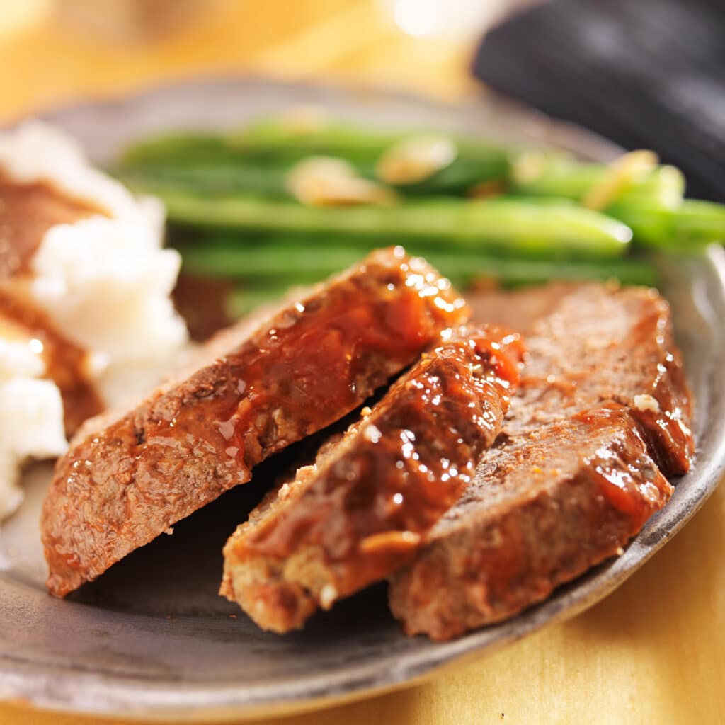 Meatloaf Served With Mashed Potatoes and Fresh Greens